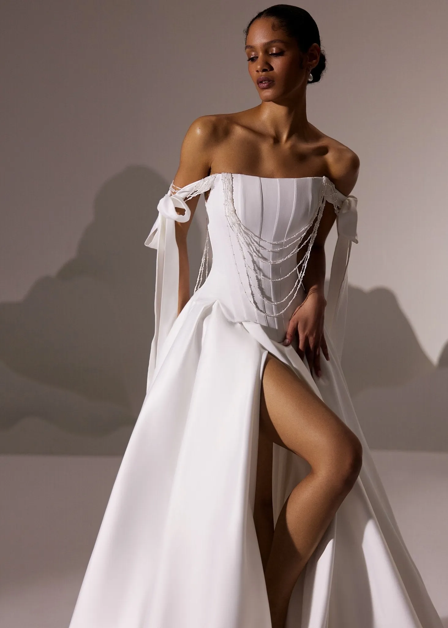 White Off-Shoulder Corset Wedding Gown with Draped Bodice and Flowing Train - Plus Size