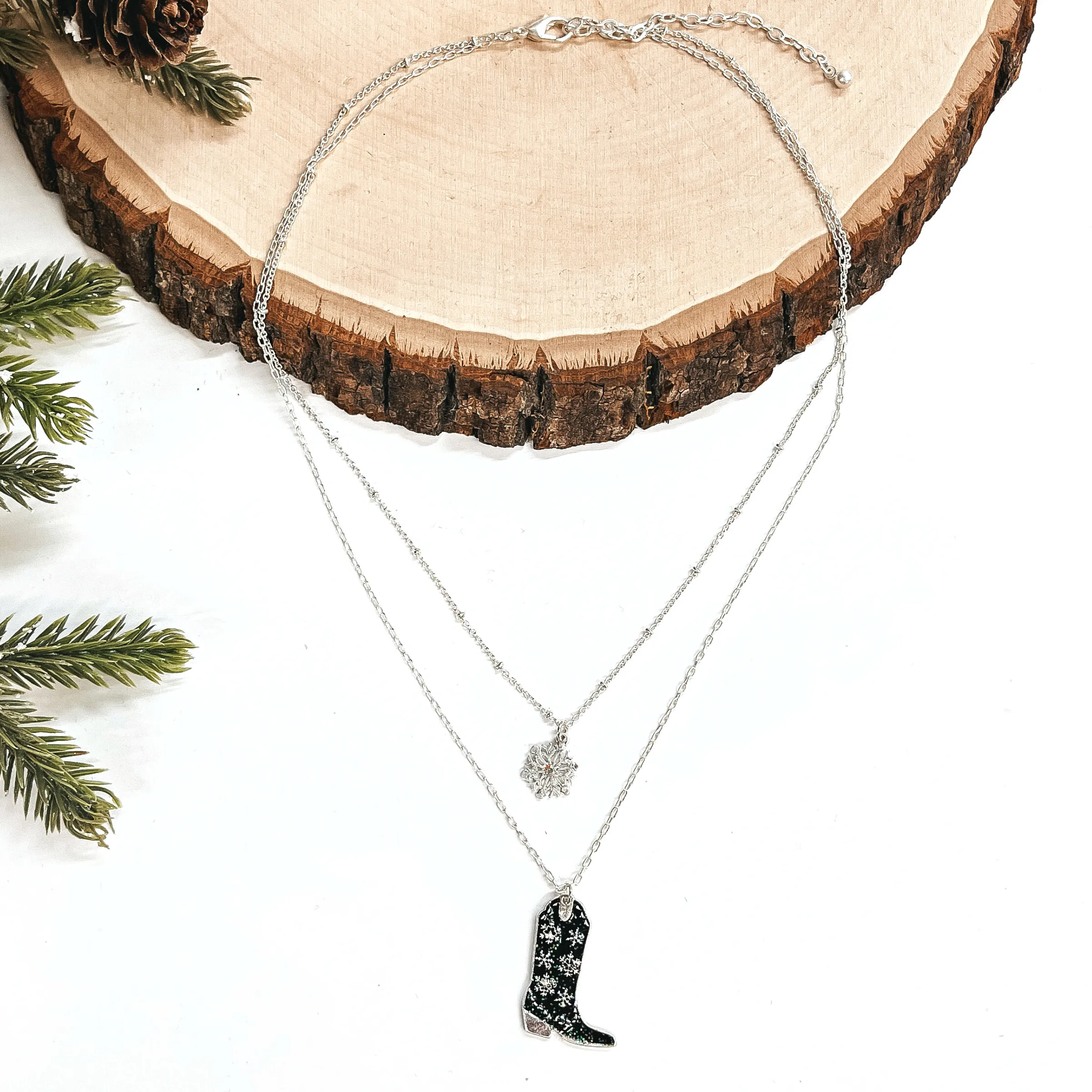 Winter Fate Double Strand Silver Tone Necklace with Silver Tone Snowflake and Snowflake Patterned Boot Pendant in Black